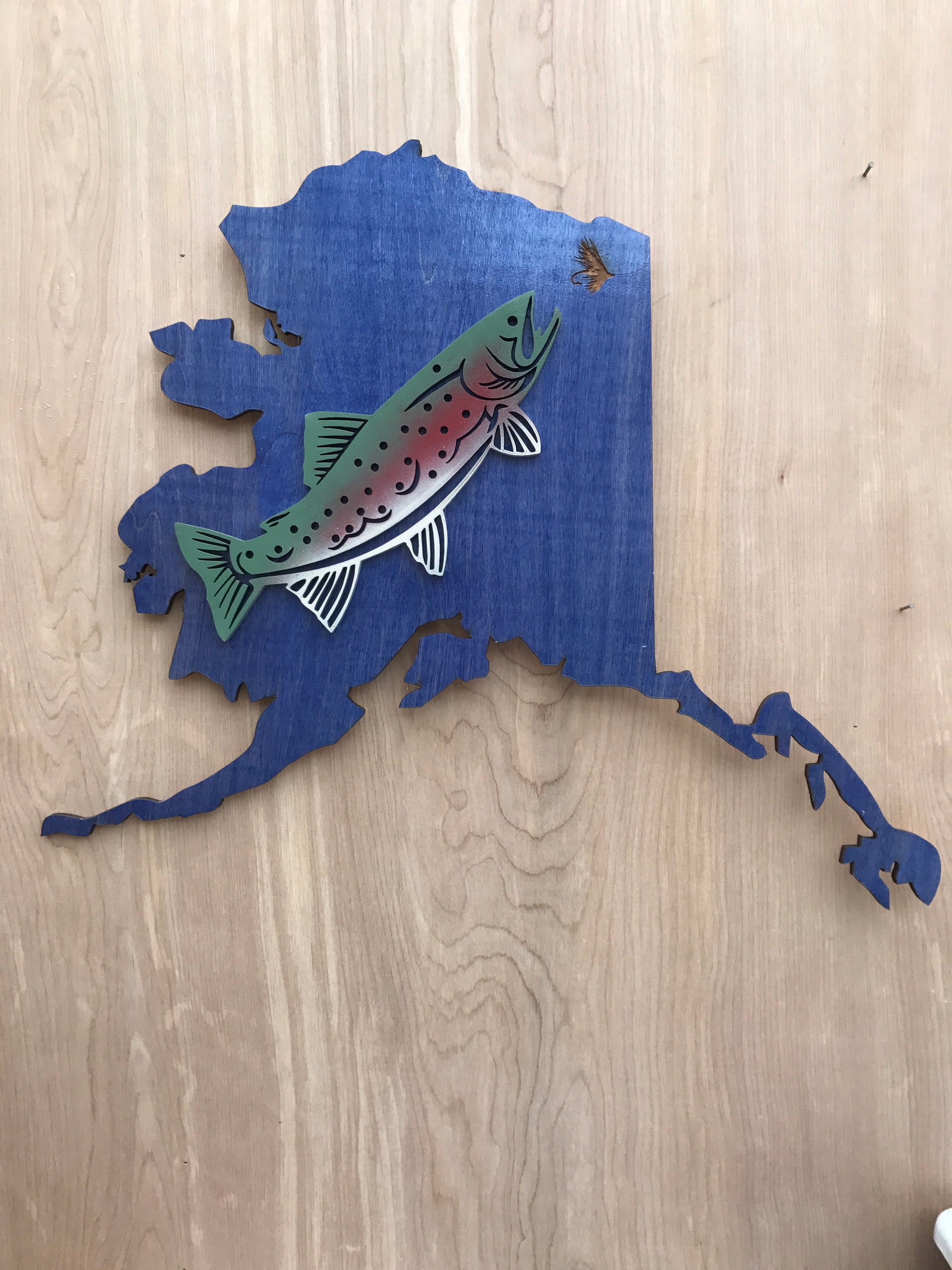 Alaska map with trout sign